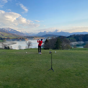 A golfer records his swing with Golfpod